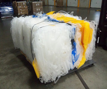 Industrial Netting utilizes a baler to create bales of recycled materials!